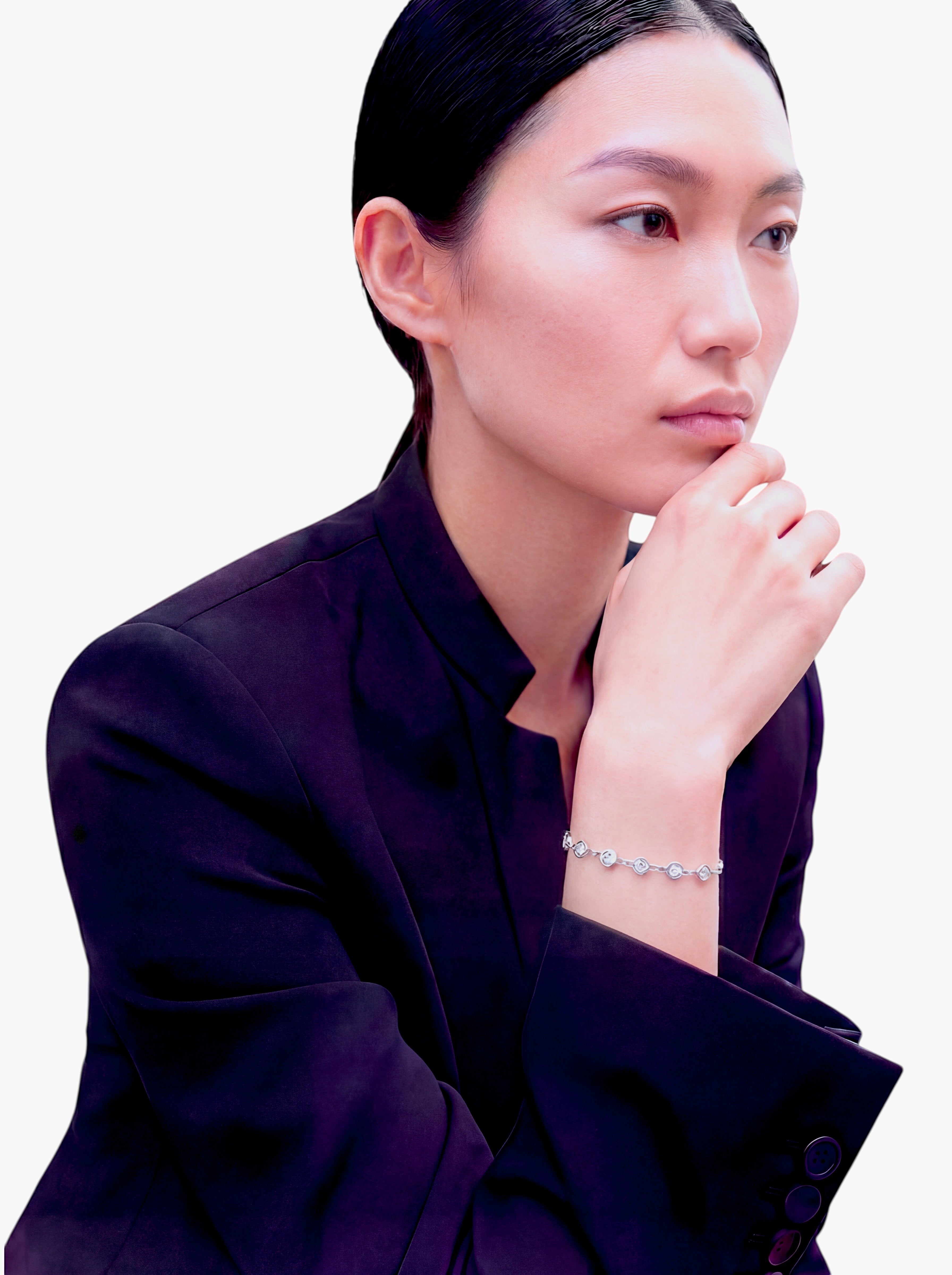 stem&stone sterling silver bangle bracelet with multiple round faceted Moissanite stones.